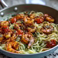 One-Pot Garlic Shrimp with Angel Hair pasta in a fragrant lemon-garlic sauce, served with fresh vegetables and a sprinkle of parsley.